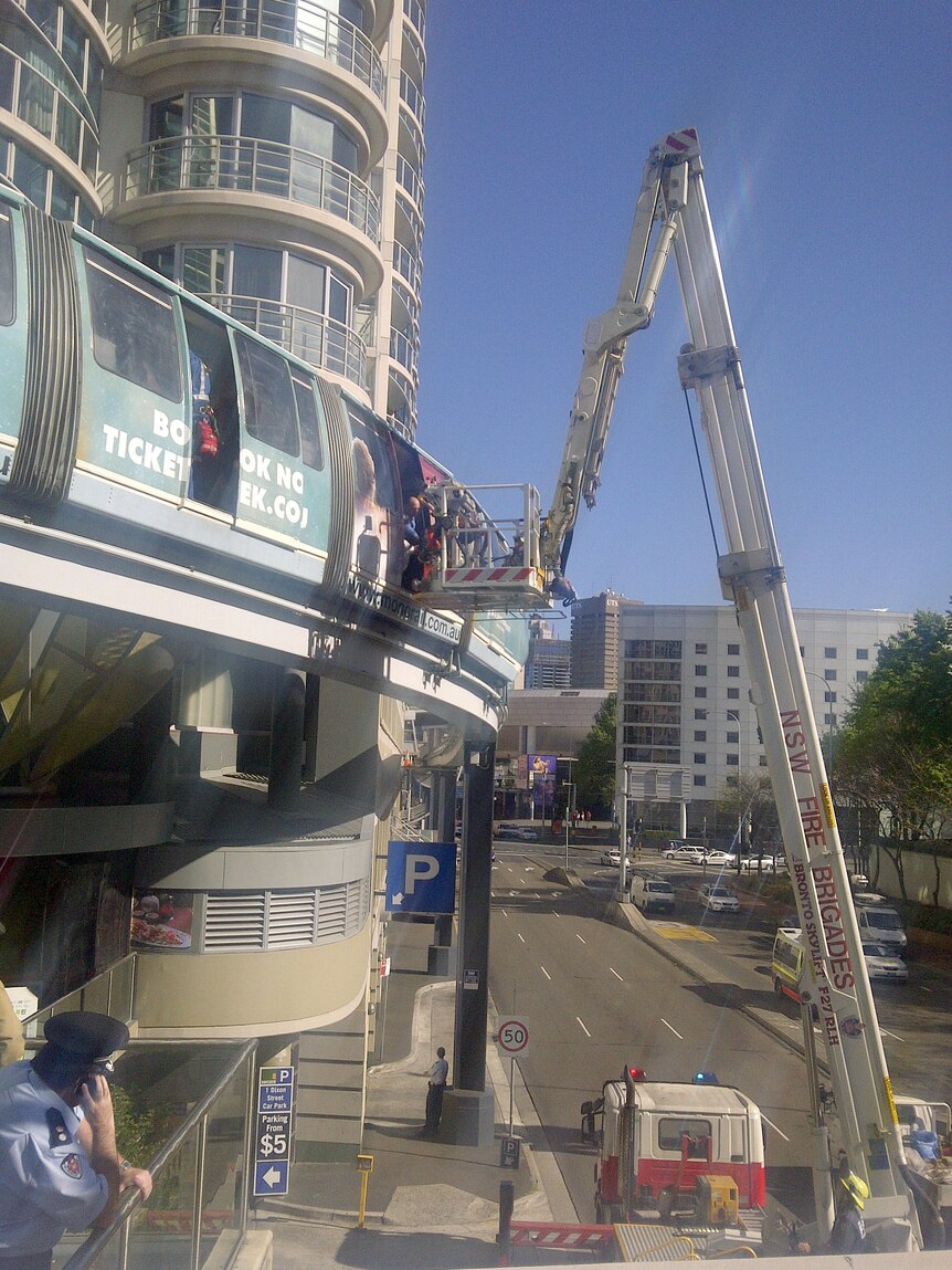 Firefighters used a crane to evacuate the stranded passengers.