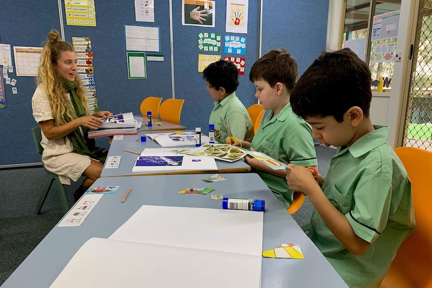 Children and a teacher in a classroom at The Glenleighden School in Brisbane's west.