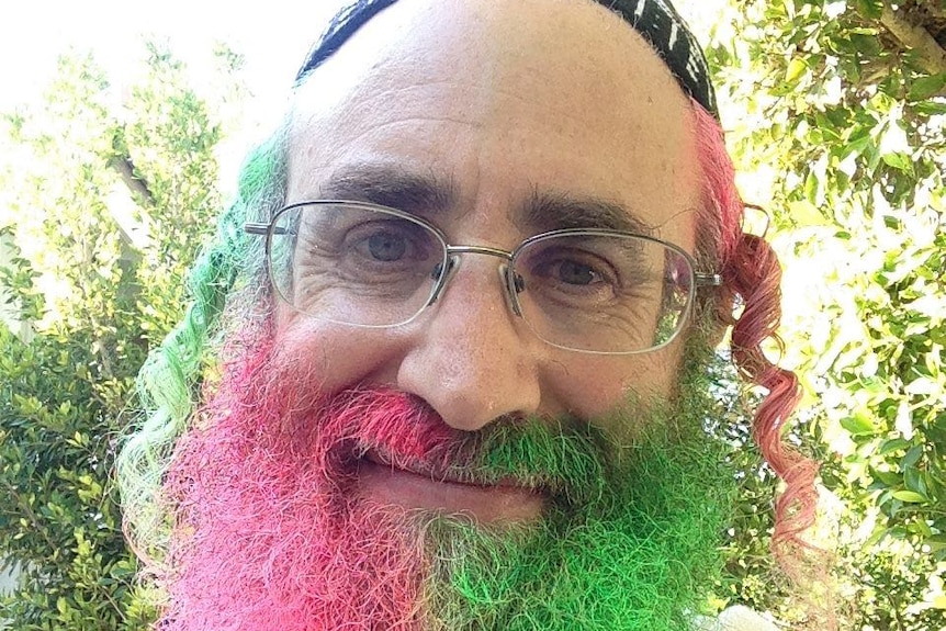Rabbi Weissman with a pink and green-dyed beard.