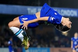 Sam Kerr midway through a backflip after scoring a goal for Chelsea in the UEFA Women's Champions League.