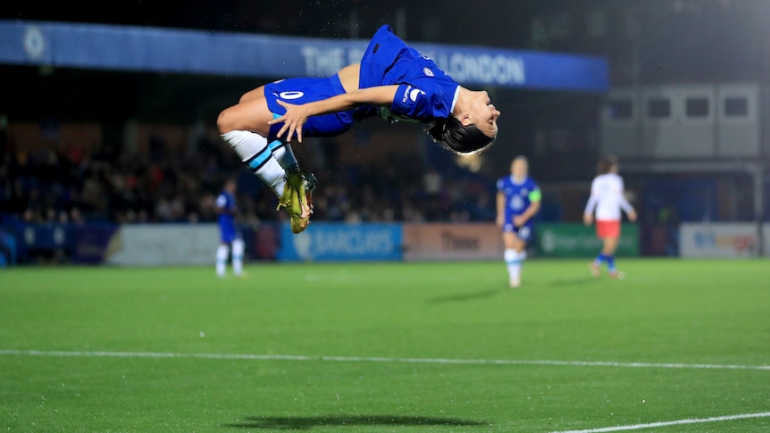Sam Kerr midway through a backflip after scoring a goal for Chelsea in the UEFA Women's Champions League.