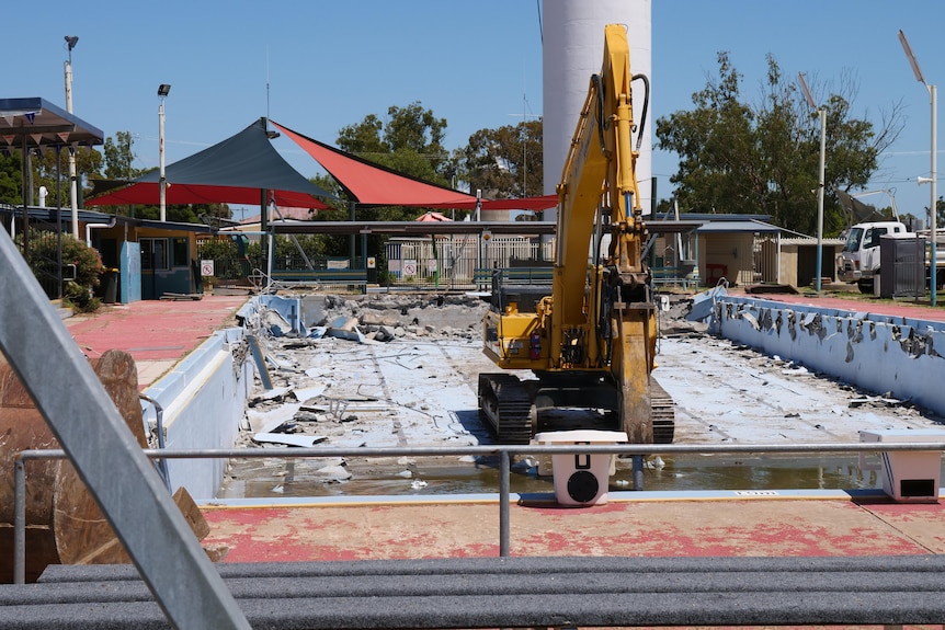 Construction equipment at the site of the pool.