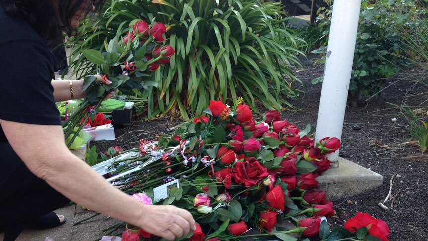 Red roses are placed in a tribute to murder victim Jody Meyers outside the Murray Bridge local government centre.