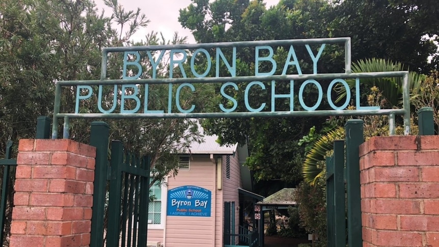 A sign over a gate reads Byron Bay Public School.