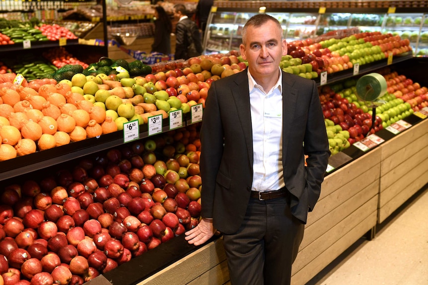 Woolworths chief executive Brad Banducci standing in the fruit section at one of his company's supermarkets.