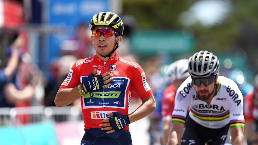 Caleb Ewan puts his hand on his chest.