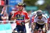 Caleb Ewan puts his hand on his chest.