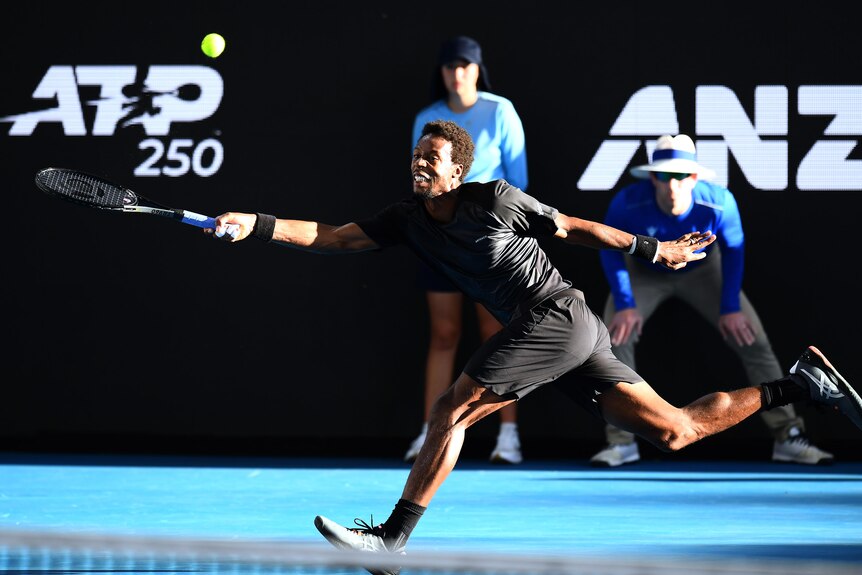 Gaël Monfils stretches for a forehand.
