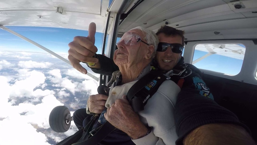 Sam Westwood about to jump from a plane on a tandem skydive.