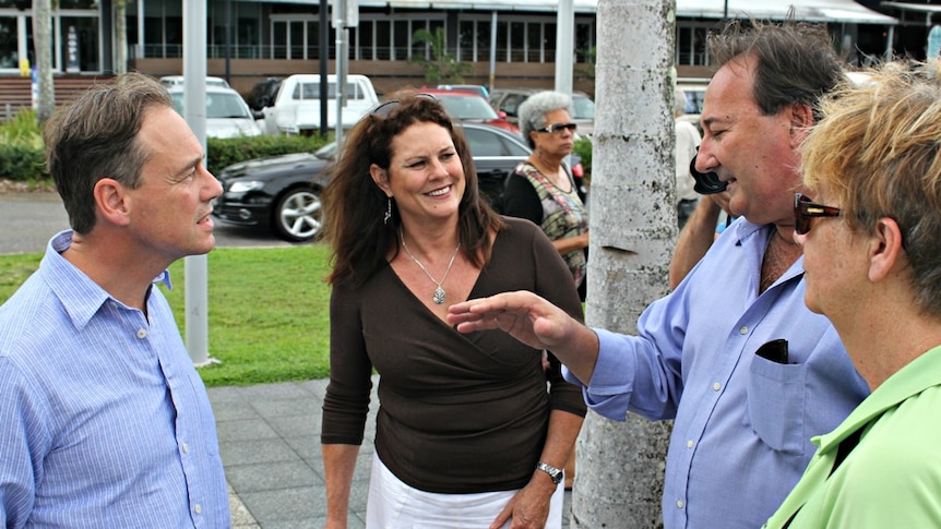 Minister Greg Hunt listening intently to cane farmer at a funding announcement to help protect the reef