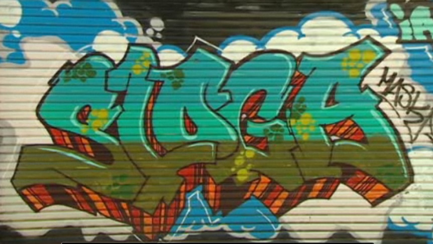 A video still of graffiti on a wall.