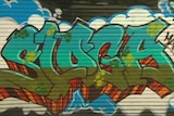 A video still of graffiti on a wall.