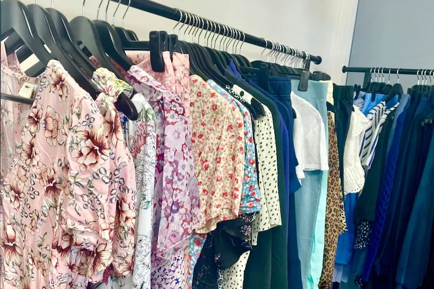 Dresses, pants and a range of clothes on racks