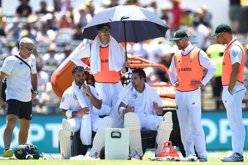 South Africa's JP Duminy and Dean Elgar recover from the heat during drinks at the WACA