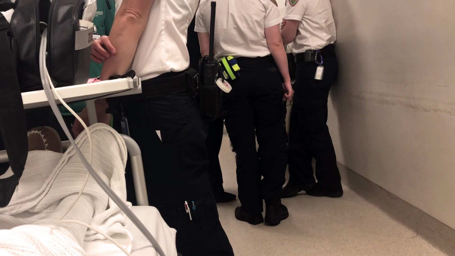 Tasmanian ambulance officers in hospital hallway
