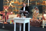 A priest conducts a service at a Protestant church in The Hague