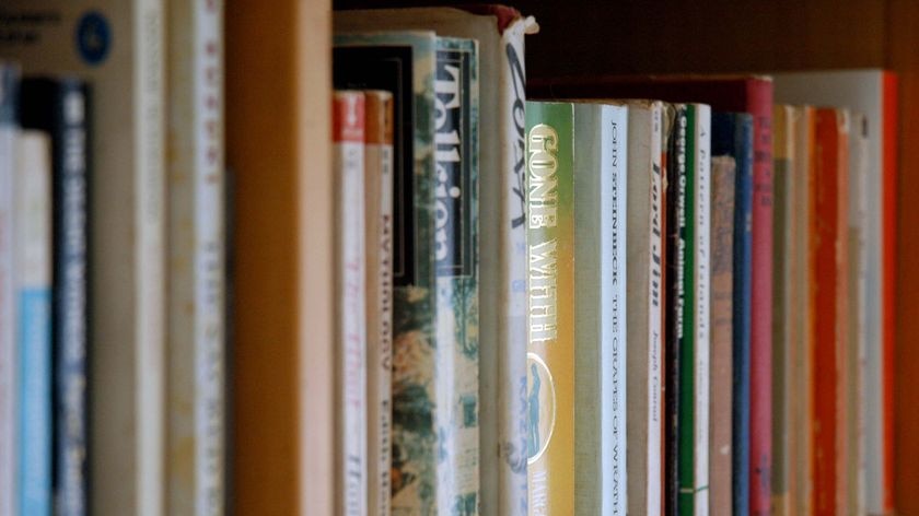 Books sit on a shelf, October 2008.