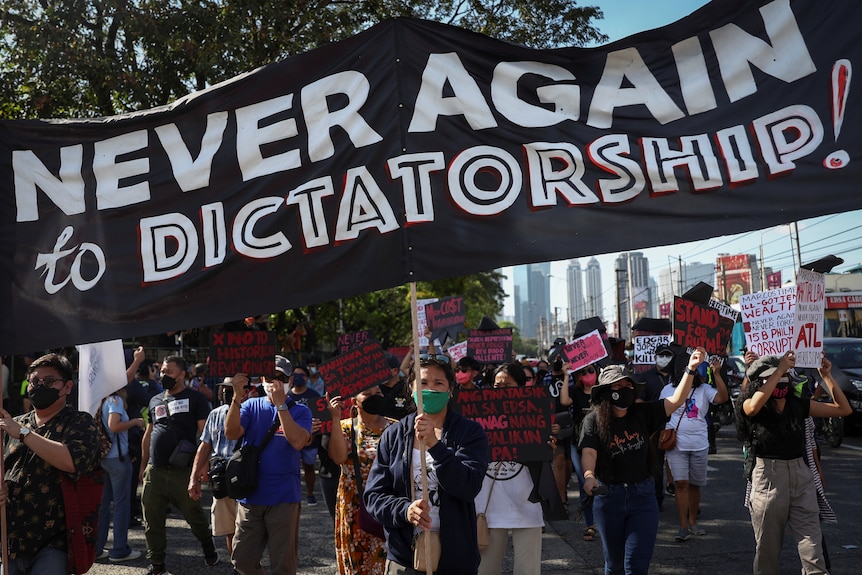 A sign saying 'never again to dictatorship'.