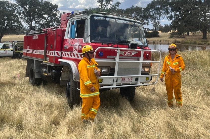 Two CFA fire fighters with their 31-year-old fire truck