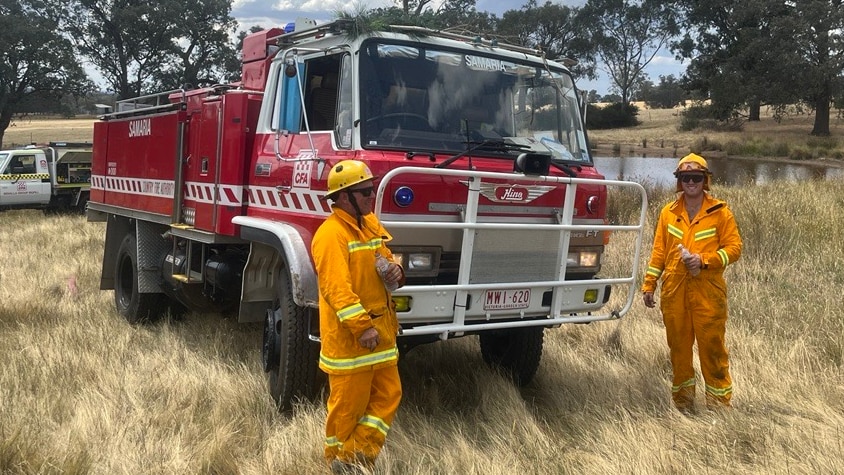 Two CFA fire fighters with their 31-year-old fire truck