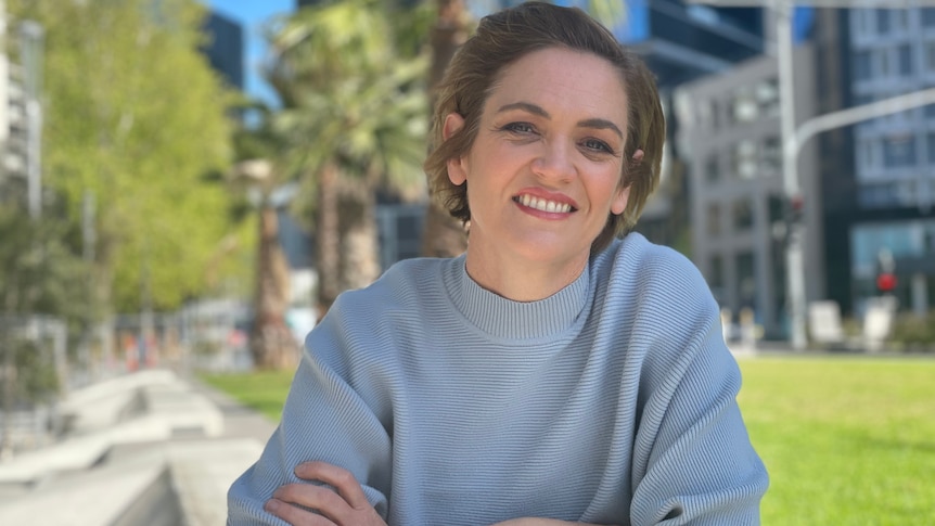 A woman sitting in a park.