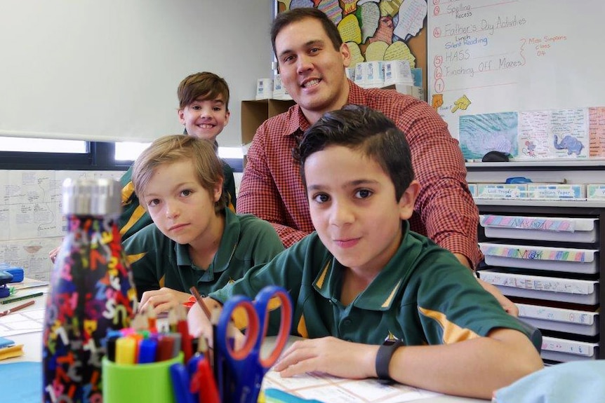 Year 4 teacher Karl Bodenstedt in the classroom with students.