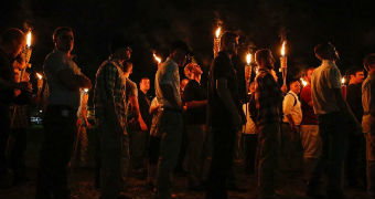 People march in the darkness with torches