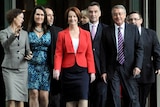 Prime Minister Julia Gillard arrives with supporters for the leadership vote at Parliament House.