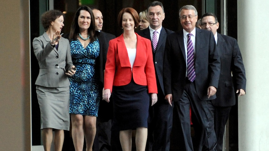Prime Minister Julia Gillard arrives with supporters for the leadership vote at Parliament House.