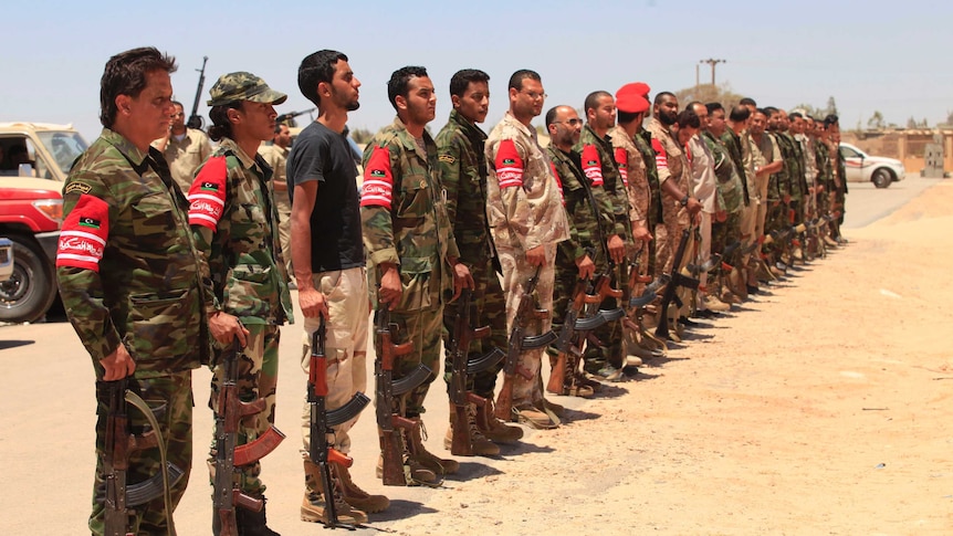 Libyan soldiers at militiaman funeral