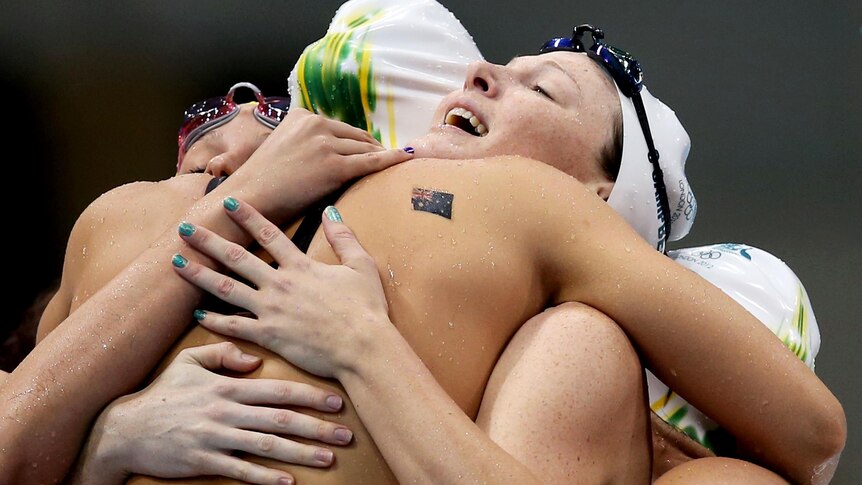 The Australian women's 4 x 100m relay team celebrate as one after breaking the Olympic record.