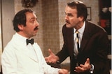 Andrew Sachs opposite John Cleese in the hit comedy Fawlty Towers.