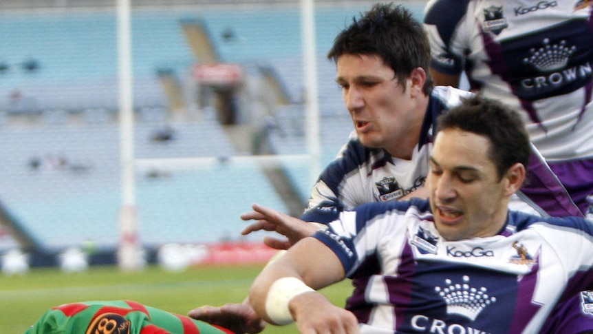 Denied ... some tight defence from Billy Slater stops Nathan Merritt from scoring in the corner.