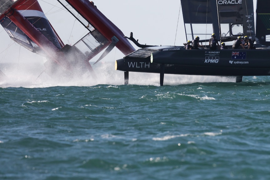 Boat capsizing behind another during a race