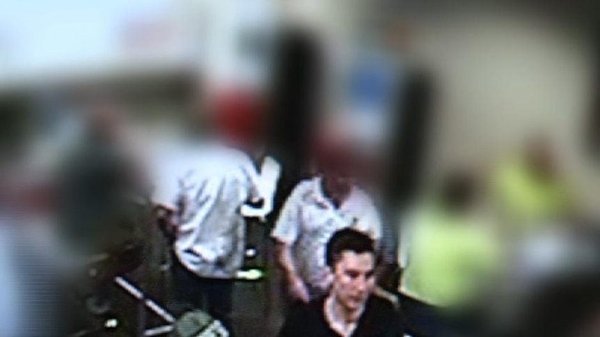On camera ... NSW police have released CCTV images of two men placing bets at the Mid Town TAB.