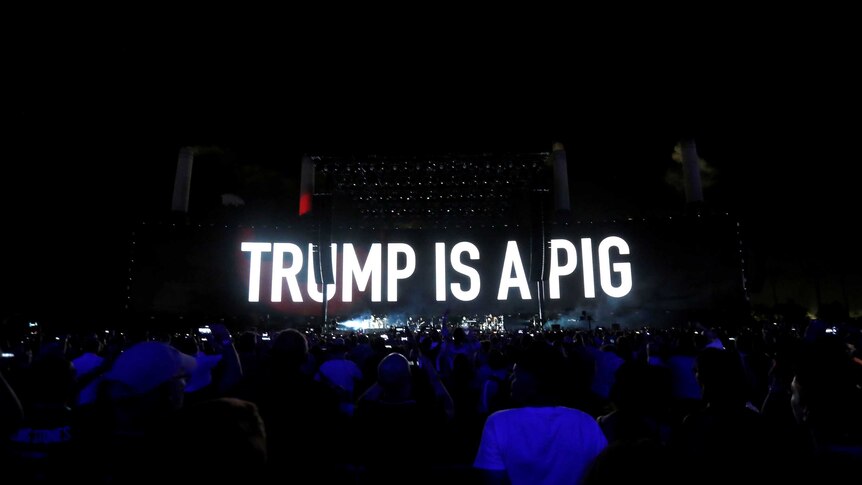 The words 'Trump is a pig' are projected on a screen at a Roger Waters concert in California.