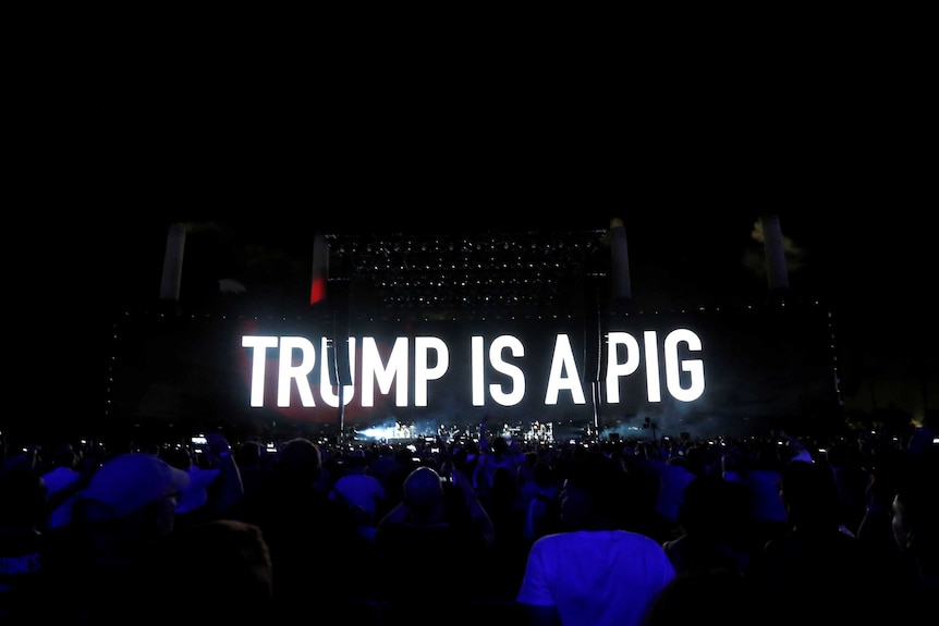 The words 'Trump is a pig' are projected on a screen at a Roger Waters concert in California.