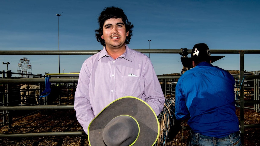 A rider poses for a photograph at the Mount Isa Rodeo.