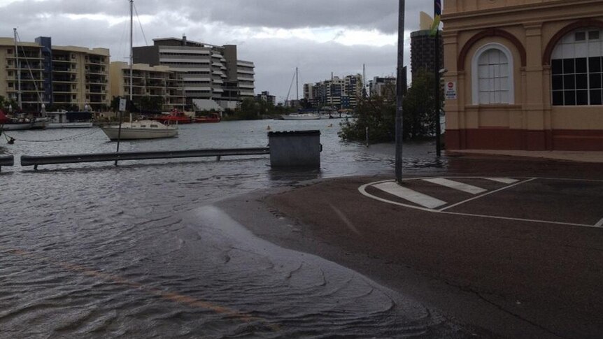 A king tide has inundated Wickham Street, Townsville