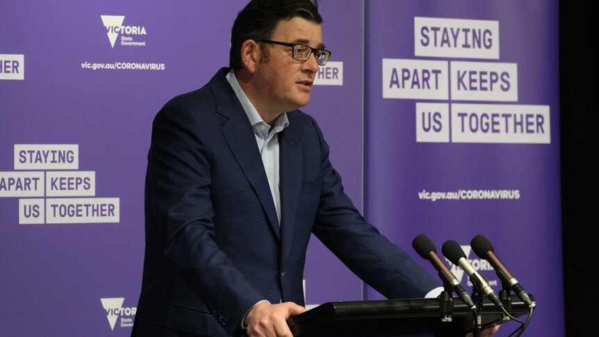 A photograph of Victorian Premier Daniel Andrews at a press conference.