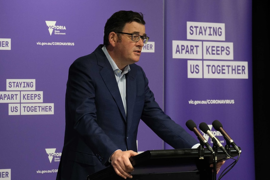 A photograph of Victorian Premier Daniel Andrews at a press conference.