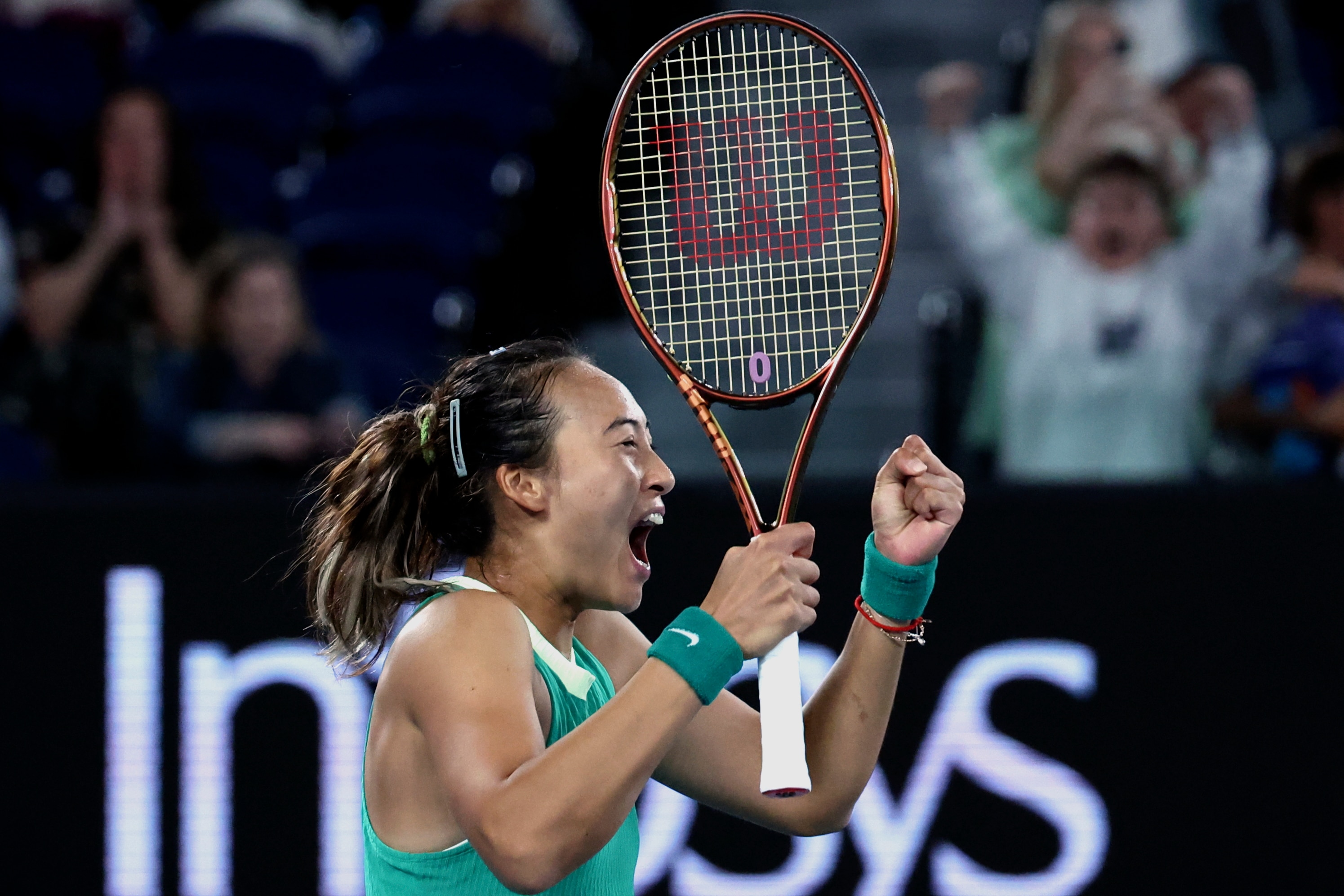 Qinwen Zheng shouts after winning her Australian Open semifinal.