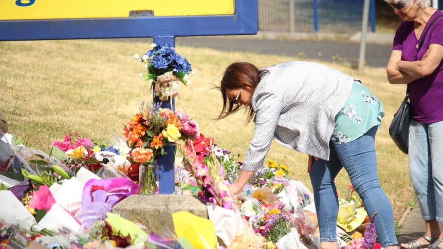 Tributes left at school as community grieves over deadly jumping castle incident