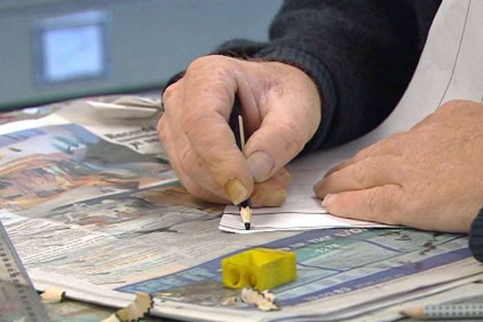 A man draws during an art therapy class.