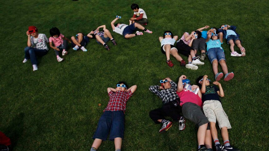 Students watch an annular eclipse