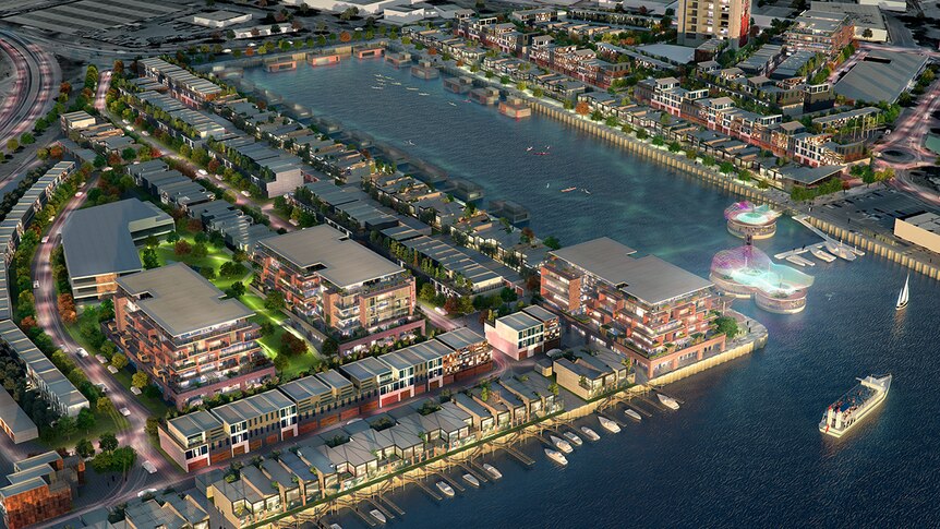 A digital rendering of townhouses and apartments around an old dock