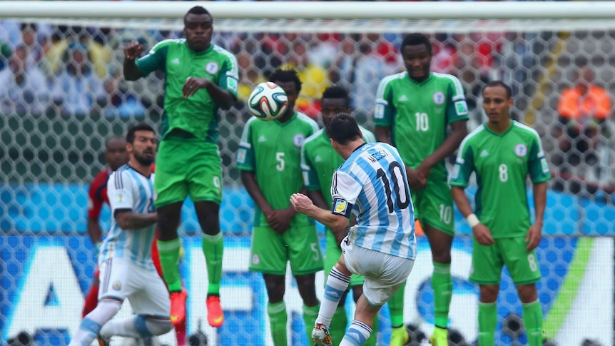 Argentina's Lionel Messi scores from a free-kick against Nigeria.