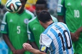 Argentina's Lionel Messi scores from a free-kick against Nigeria.