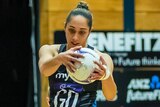 A Silver Ferns player catches the ball during a Constellation Cup Test against Australia.
