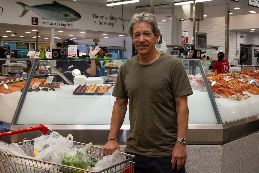 Consumer Michael Shakinovsky in front of a seafood outlet at Sydney Fish Market.